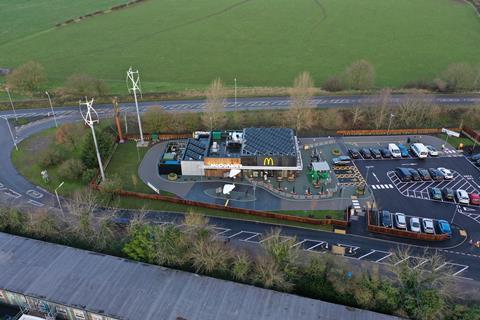Aerial shot of new McDonald's featuring solar panels and wind turbines